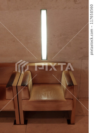 wiener modernism in design and architecture at the beginning of 1900, example in this leather armchair and marble wall 117658560