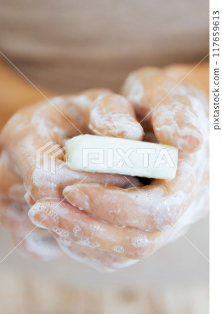 Closeup on young woman hands with soap 117659613