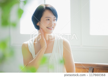 Middle-aged woman doing skin care 117660368