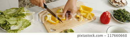 Woman Cutting Vegetables For Salad Woman Cutting Vegetables For Salad 117660668