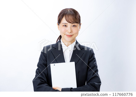 Smiling businesswoman holding a tablet Smiling businesswoman holding a tablet 117660776