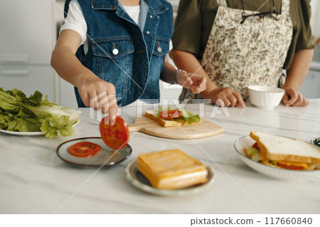 Family Cooking Sandwich Together At Home Family Cooking Sandwich Together At Home 117660840