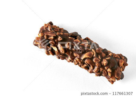 Chocolate wafer bar with caramel and peanuts isolated on white background. Top view with copy space Chocolate wafer bar with caramel and peanuts isolated on white background. Top view with copy space 117661307