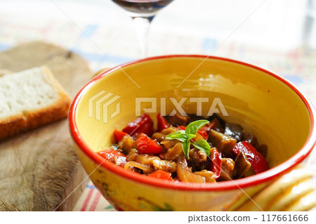 Caponata, a traditional Sicilian dish of summer vegetables stewed in tomato sauce Caponata, a traditional Sicilian dish of summer vegetables stewed in tomato sauce 117661666