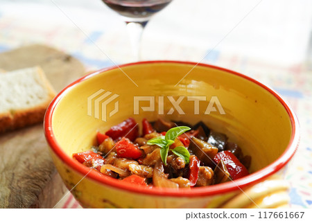 Caponata, a traditional Sicilian dish of summer vegetables stewed in tomato sauce 117661667