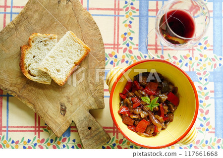 Italian traditional Sicilian dish, Caponata, stewed summer vegetables with tomatoes, aerial view 117661668
