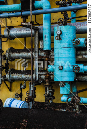 Valves and tanks that have been abandoned, rusted and decayed 117662657