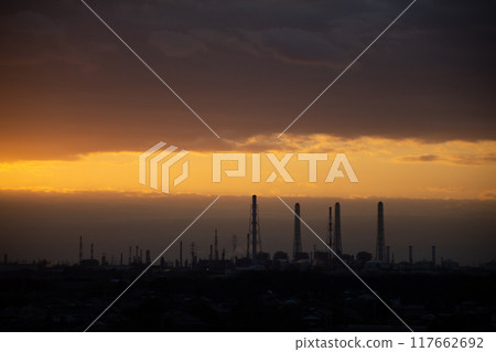 A telephoto shot of a factory at dusk A telephoto shot of a factory at dusk 117662692