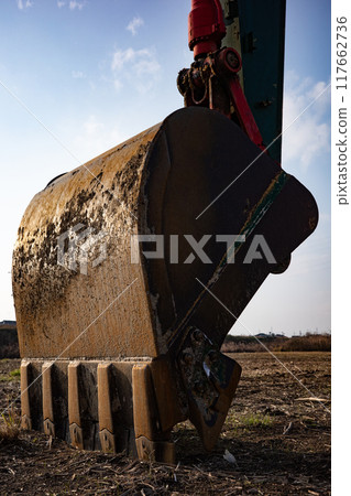 Excavator shovel at a construction site 117662736