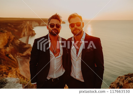 Two bearded men, a gay couple, hold hands. Two bearded men, a gay couple, hold hands. 117663530