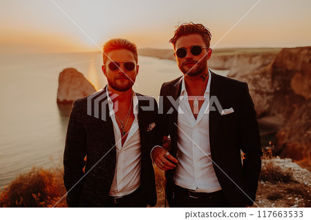 Two bearded men, a gay couple, hold hands. Two bearded men, a gay couple, hold hands. 117663533