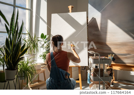 Creativity, drawing or sketch painter woman ready to start on artwork project on clean easel. Creativity, drawing or sketch painter woman ready to start on artwork project on clean easel. 117664164