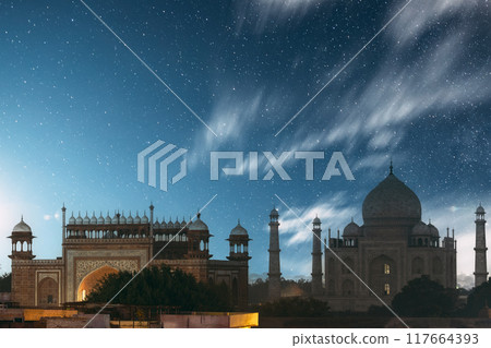 Taj Mahal In Agra, Uttar Pradesh, India. Night Starry sky above Taj Mahal. Seven World Wonders. Fabulous Taj Mahal Travel Concept. Crowds Of Tourists Visit Taj Mahal. Indian Islamic Heritage At Night Taj Mahal In Agra, Uttar Pradesh, India. Night Starry sky above Taj Mahal. Seven World Wonders. Fabulous Taj Mahal Travel Concept. Crowds Of Tourists Visit Taj Mahal. Indian Islamic Heritage At Night 117664393