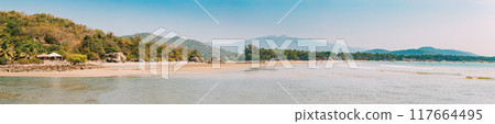 Canacona, Goa, India. Sunny Sky Over Calm Water Of Arabian Sea. Natural Landscape With Sandy Palolem Beach At Sunny Summer Day With Blue Sky Canacona, Goa, India. Sunny Sky Over Calm Water Of Arabian Sea. Natural Landscape With Sandy Palolem Beach At Sunny Summer Day With Blue Sky 117664495