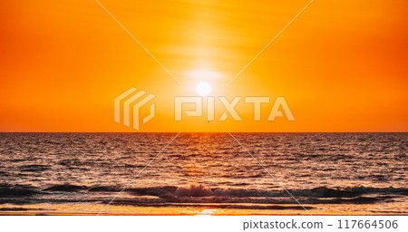 Natural Color Sunset Sunrise Sky Over Sea. Seascape With Shining Setting Sun On Sea Horizon 117664506