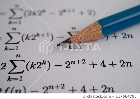 Pencil on mathematic formula exercise test paper in education school. Pencil on mathematic formula exercise test paper in education school. 117664795