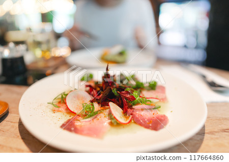Japanese food Sashimi tuna salad asian foodie woman background at indoor restaurant on day 117664860