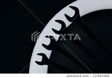 Silhouettes Of Steel Spanners Laid Out In Line On Ring Light In Darkness 117665906