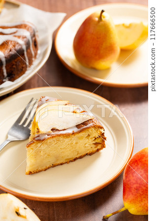 Pear pie. Homemade cake. Fruit dessert on a plate.  117666500