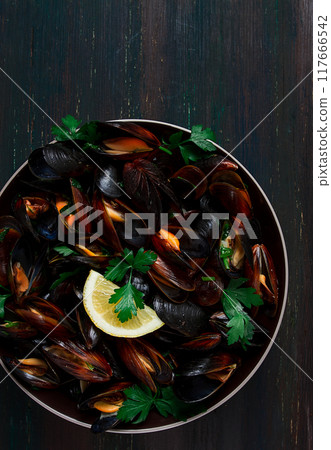 Fresh, Boiled mussels, Black Sea, with parsley and lemon, no people, top view Fresh, Boiled mussels, Black Sea, with parsley and lemon, no people, top view 117666542