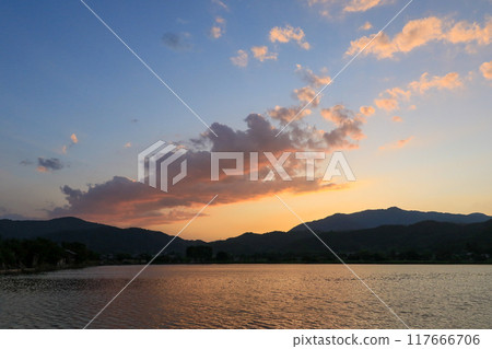 Beautiful sunset sky with mountains and clouds 117666706