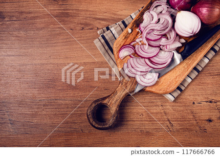 sliced red onion, on a chopping board, with a knife,Spanish onion, raw onion, close-up, top view, sliced red onion, on a chopping board, with a knife,Spanish onion, raw onion, close-up, top view, 117666766