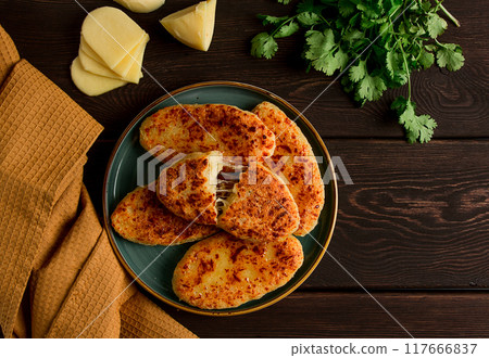 Chvishtari, corn flour tortillas with cheese, pastries, Georgian cuisine, Mchadi, homemade, top view, on a wooden table, no people, 117666837
