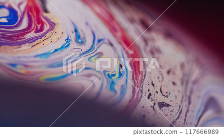 Oil fluid stain. Blur ink mix. Defocused purple pink blue yellow color acrylic emulsion bubbles wave on dark abstract art background. 117666989