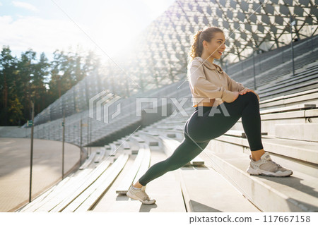 Young woman with smart watch goes in for sports, performs sport exercises. Sport, Active life. 117667158
