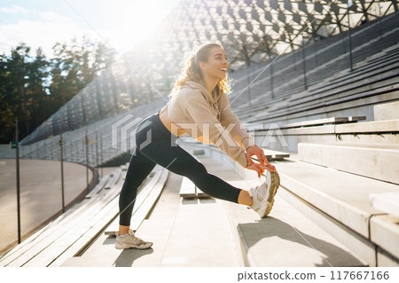 Young woman with smart watch goes in for sports, performs sport exercises. Sport, Active life. Young woman with smart watch goes in for sports, performs sport exercises. Sport, Active life. 117667166