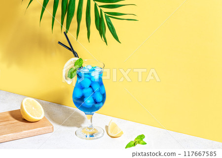 Blue Lagoon Cocktail on yellow Blue Lagoon Cocktail on yellow 117667585
