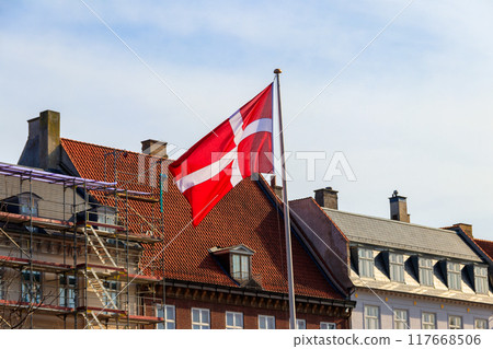 Waving flag of Denmark on a city street Waving flag of Denmark on a city street 117668506