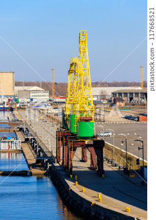Old cranes on city boulevard in Szczecin, Poland 117668521