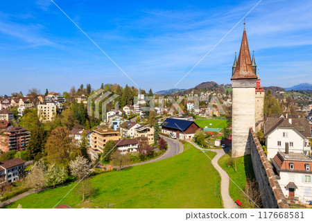 Top view on the old town with Musegg wall and towers in Lucerne city, Switzerland Top view on the old town with Musegg wall and towers in Lucerne city, Switzerland 117668581