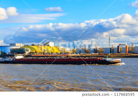 Industrial barge carrying scrap metal for recycling on the river Elbe in Hamburg, Germany Industrial barge carrying scrap metal for recycling on the river Elbe in Hamburg, Germany 117668595