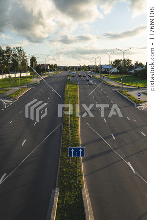 Highway in the evening view from the bridge down. Evening city, motorway Highway in the evening view from the bridge down. Evening city, motorway 117669108