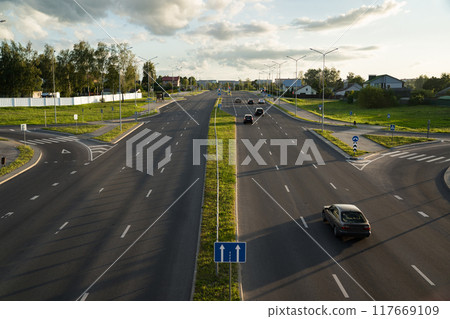Highway in the evening view from the bridge down. Evening city, motorway Highway in the evening view from the bridge down. Evening city, motorway 117669109