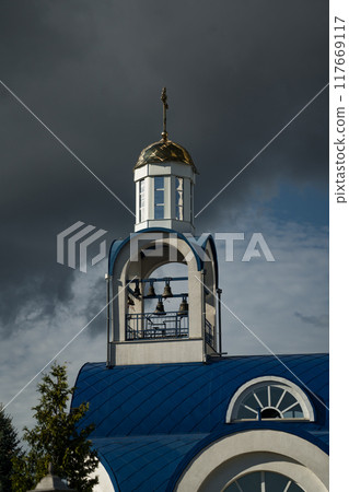 A white church with a blue roof in the Belarusian city of Zhodino. Clouds A white church with a blue roof in the Belarusian city of Zhodino. Clouds 117669117