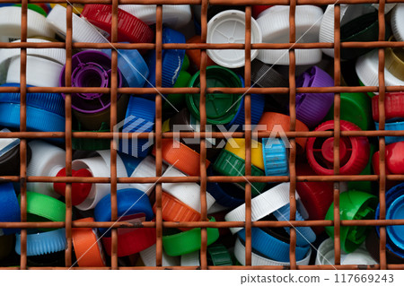 Lots of colorful, plastic bottle caps 117669243