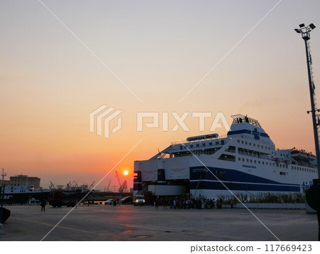 Sunrise and ferry arriving at the port of Naples (Italy) Sunrise and ferry arriving at the port of Naples (Italy) 117669423