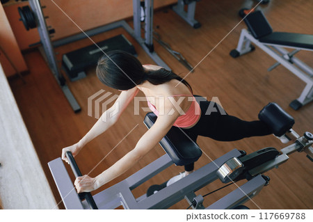 Fit Legs Of A Woman Lifting Weight  117669788