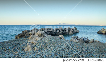 rocks in the calm blue sea of Cyprus. 117670868