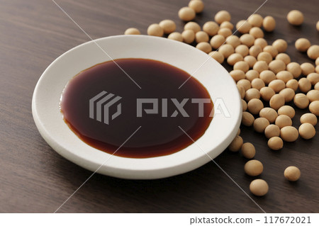 Soy sauce poured into a plate 117672021