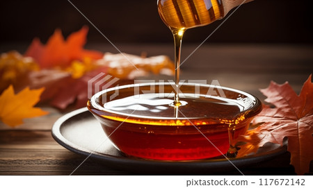 Maple syrup drizzling from a wooden ladle into a bowl, creating a sweet and aromatic addition to any dish or dessert. AI Generated Maple syrup drizzling from a wooden ladle into a bowl, creating a sweet and aromatic addition to any dish or dessert. AI Generated 117672142