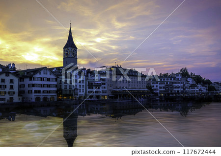 sunset scenic view of historic Zurich city center with famous Fraumunster and river Limmat at Lake Zurich,Switzerland 117672444