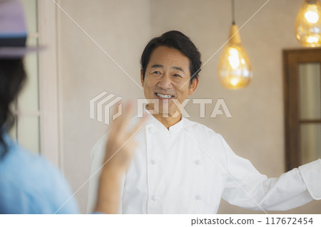 A man working at a cafe A man working at a cafe 117672454