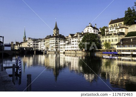 sunset scenic view of historic Zurich city center with famous Fraumunster and river Limmat at Lake Zurich,Switzerland 117672463
