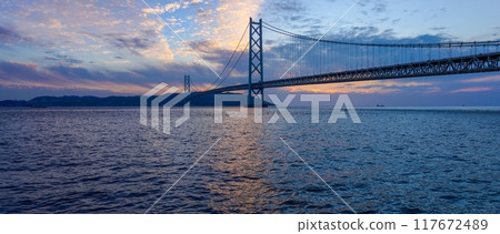 Panoramic view of the Akashi Kaikyo Bridge and the sunset Panoramic view of the Akashi Kaikyo Bridge and the sunset 117672489