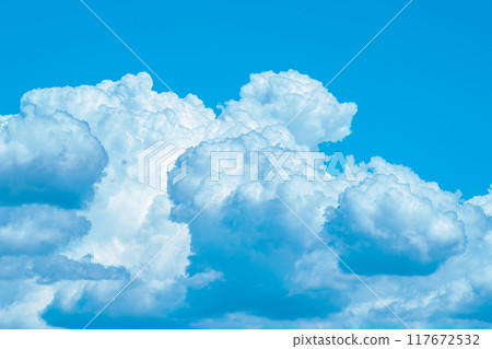 Summer cumulonimbus clouds covering the blue sky c-3 light color 117672532