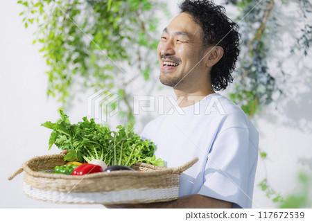 Man holding fresh vegetables Man holding fresh vegetables 117672539